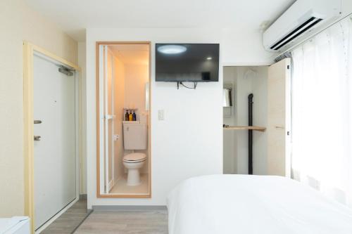 a bathroom with a toilet in a room at Kyoto Waka Hotel in Kyoto