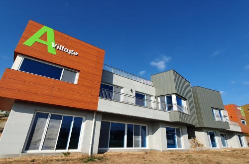 a building with aadobeadobe sign on the side of it at Seoul YMCA Goyang International Youth Culture Center Youth Center in Goyang