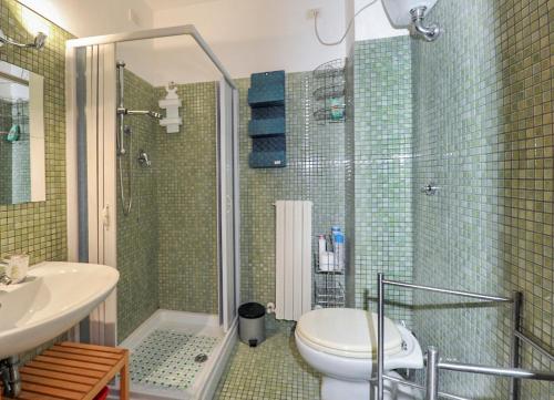 a bathroom with a shower and a toilet and a sink at Vado al teatro monolocale in centro per 2 in Ancona
