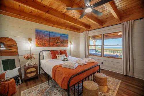 a bedroom with a bed and a ceiling fan at Incredible Views l Family Friendly I Pool - Hot Tub in Sevierville