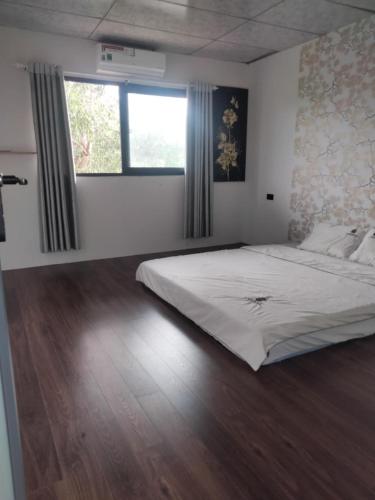 Postel nebo postele na pokoji v ubytování Homstay cát trắng