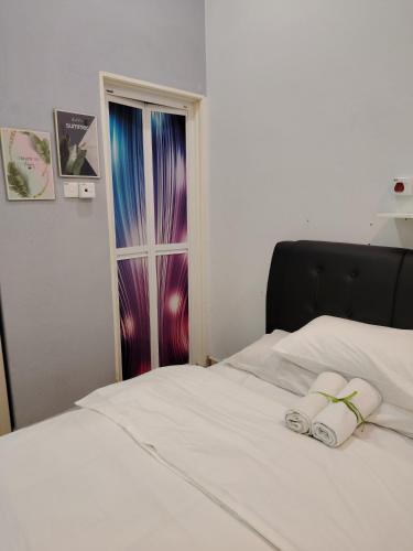 Postel nebo postele na pokoji v ubytování Inap Idaman 1