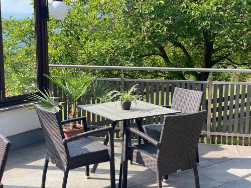 a table and chairs sitting on a patio at Sturmhof in Chiusa