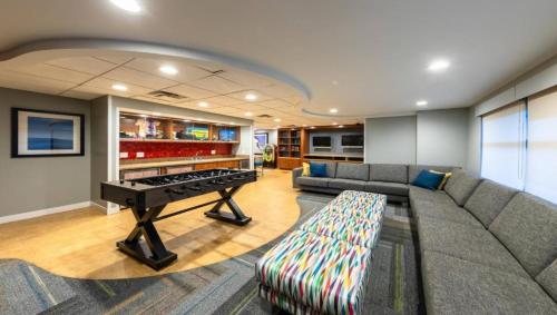 a living room with a couch and a piano at Marriott Timber Lodge Luxury Studio in Stateline
