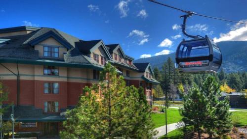 a gondola ride in front of a house at Marriott Timber Lodge Luxury Studio in Stateline