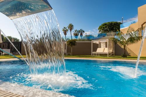 a water fountain in a swimming pool at GF Victoria in Adeje