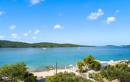 a view of a beach with boats in the water at Awesome Apartment In Sibenik With Wifi in Šibenik