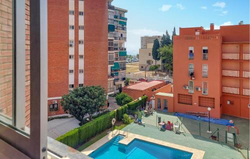 a view of a pool from a building at Pet Friendly Apartment In Torremolinos in Torremolinos