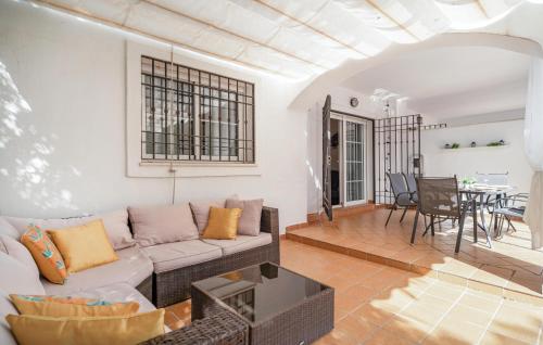 a living room with a couch and a table at Beautiful Apartment In Sabinillas in San Luis de Sabinillas