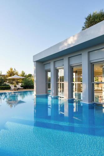 a rendering of a house with a swimming pool at Ikos Olivia in Gerakini
