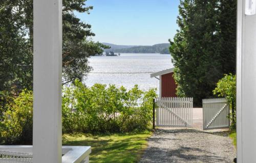 a view of the water from the porch of a house at Gorgeous Home In Lennartfors Sverige in Lennartsfors