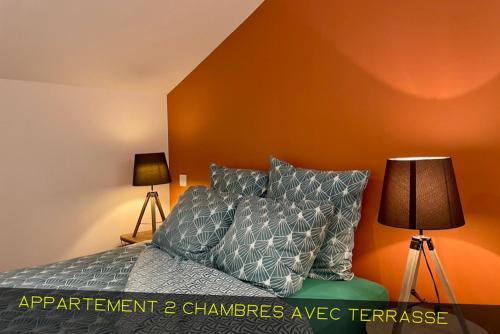 Ένα ή περισσότερα κρεβάτια σε δωμάτιο στο Les Appartements du Pont Joubert