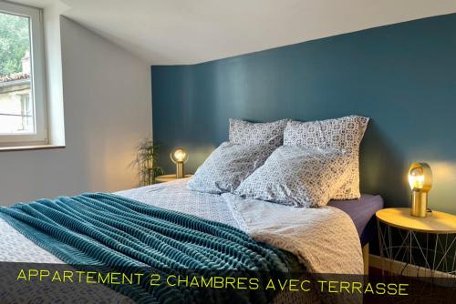 Ένα ή περισσότερα κρεβάτια σε δωμάτιο στο Les Appartements du Pont Joubert