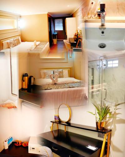 a room with two beds and a desk in a room at White Mansion Georgetown - Self Check-In in George Town