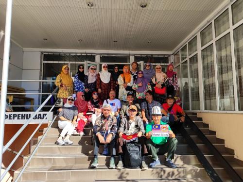 a group of people posing for a picture on steps at Tagaytay Karakol Hotel in Karakol