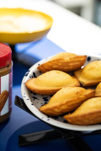 a plate of crisps on a table with a bowl of food at Graphik Montparnasse in Paris