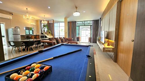 a living room with a pool table in it at PhuriPoolvilla ภูริพูลวิลล่า in Hang Dong