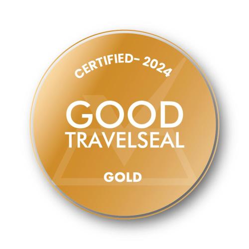 a gold medal with the words good travelledgal gold at Tagaytay Karakol Hotel in Karakol