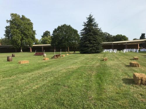 a field with hay bales in the grass at AFASEC Résidence in Marolles-en-Brie