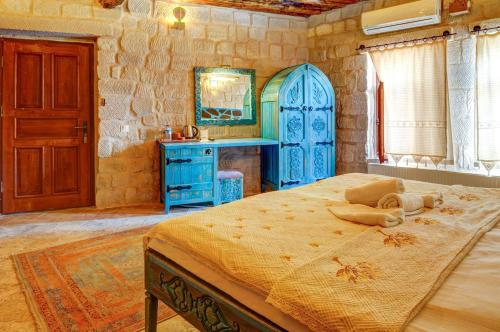 Aşk-ı Nare Cave Hotel - Swimming Pool & SPAにあるベッド