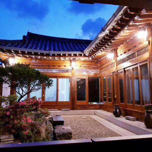 an exterior of a building at night with lights at Yeonyijae hanok stay in Gyeongju