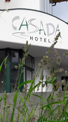 a sign for the asada hotel in front of a building at Ferienwohnung Tramunt im Hotel Casada in Galtür
