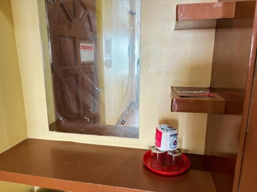 a toy room with a door and a shelf at White Beach Hotel Puerto Galera powered by Cocotel in Puerto Galera