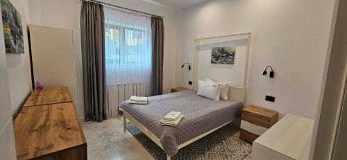 Postel nebo postele na pokoji v ubytování R&B Apartments