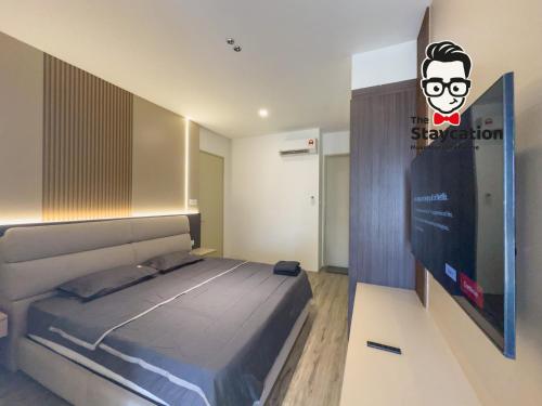 Giường trong phòng chung tại Staycation Homestay 58 Podium Apartment