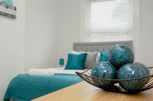 a bowl of eggs on a table in a bedroom at Large Stylish 2bedroom flat in Wood Green in London