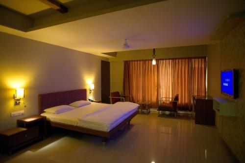 Ένα ή περισσότερα κρεβάτια σε δωμάτιο στο Hotel Platinum Inn