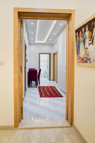 a hallway with a door leading to a dining room at jaws wave imsouane in Imsouane
