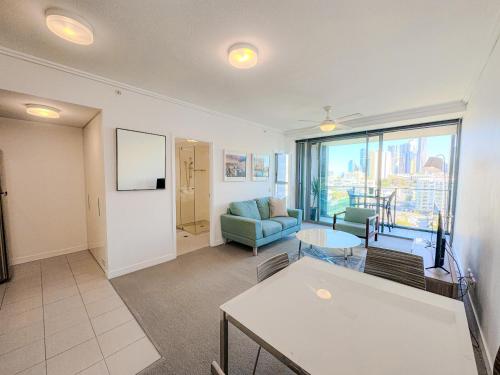 a living room with a couch and a table at Apartments on Connor in Brisbane