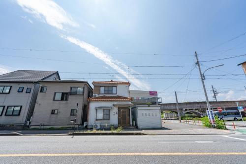 a small house on the side of a street at Fujinomiya Base SAKUYA 一棟貸切Vacation Rental in Fujinomiya