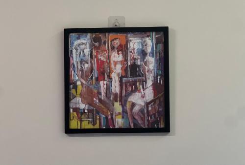 a painting hanging on a wall at Urban Cairo Maadi-Near the Nile in Cairo