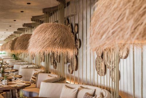 a row of tables and chairs in a restaurant at Ikos Andalusia in Estepona