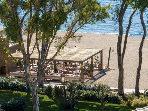 a restaurant on the beach next to the beach at Ikos Andalusia in Estepona
