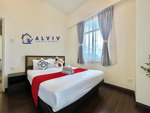 a bedroom with a bed with a teddy bear on it at Costa Mahkota - 1min I Mahkota Parade Mall I Dataran Pahlawan I Mahkota Hospital in Melaka