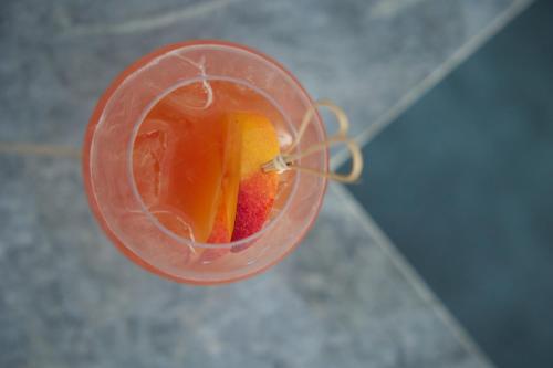 a close up of a plastic container with fruit in it at Sun Aeriko in Tinos Town