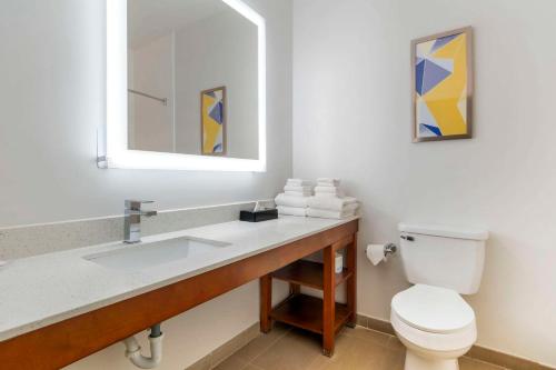 a bathroom with a sink and a toilet at Comfort Suites Keeneland in Lexington
