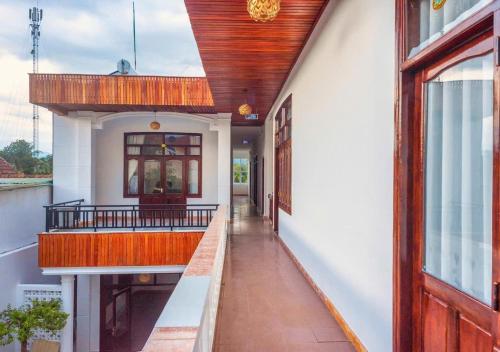 a hallway of a house with a wooden ceiling at Soc Home in Ba Tơ