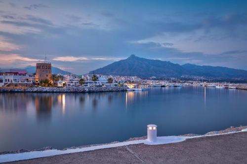 a large body of water with a town and a city at Ikos Andalusia in Estepona
