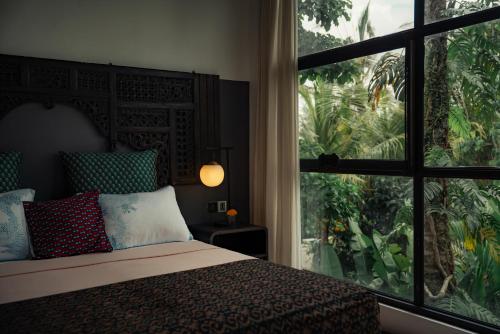 Ένα ή περισσότερα κρεβάτια σε δωμάτιο στο Dharma Oasis