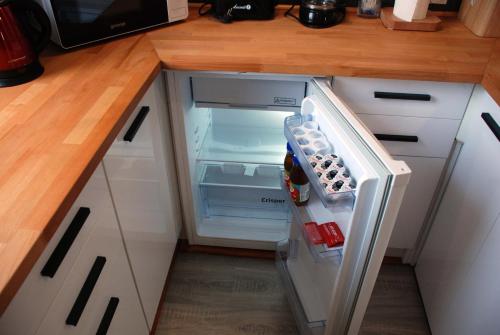 Kuchyň nebo kuchyňský kout v ubytování Apartament Legionow