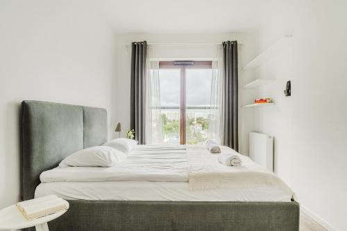 Postel nebo postele na pokoji v ubytování ShortStayPoland Naruszewicza (B77)