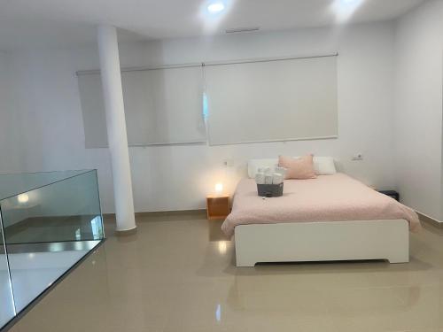 Ένα ή περισσότερα κρεβάτια σε δωμάτιο στο Ancla Real Apartamentos Loft