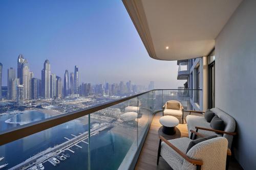 a balcony with a view of a city at 2BR Beachfront Apt with Stunning Dubai Marina View in Dubai