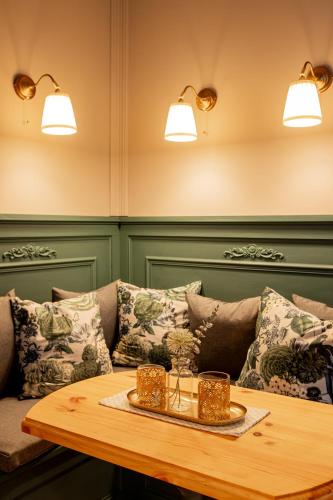 a living room with a couch and a table at Wohnen im Carl Maria von Weber Geburtshaus in Eutin