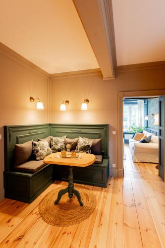 a living room with a couch and a table at Wohnen im Carl Maria von Weber Geburtshaus in Eutin