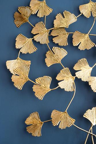 a group of gold leaves on a blue background at Wohnen im Carl Maria von Weber Geburtshaus in Eutin